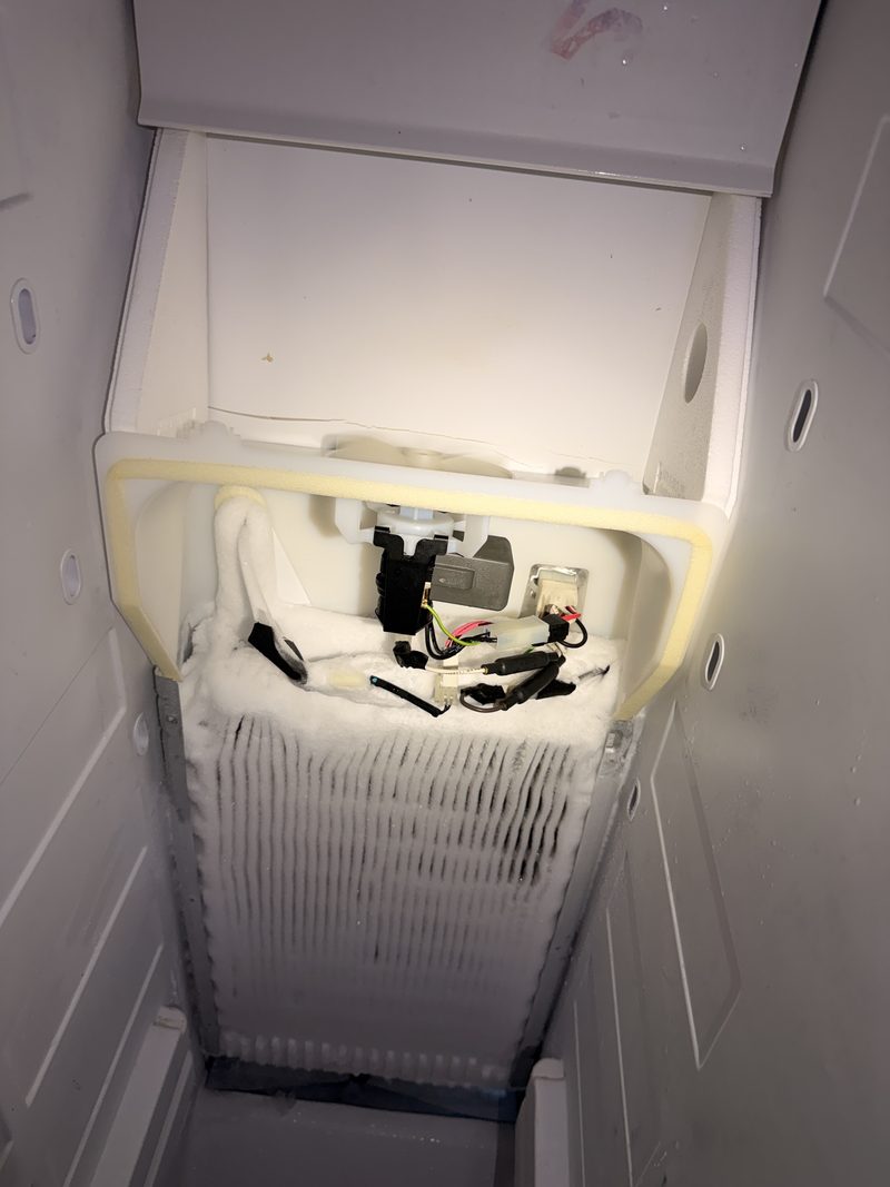 Freezer evaporator coil packed with frost after a defrost heater failure